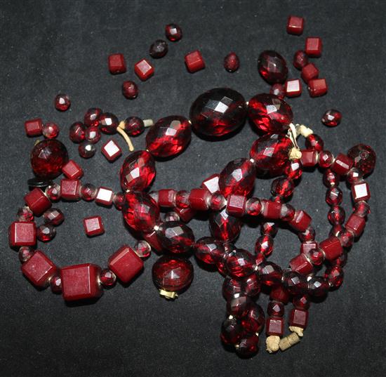 Two simulated red amber necklaces.